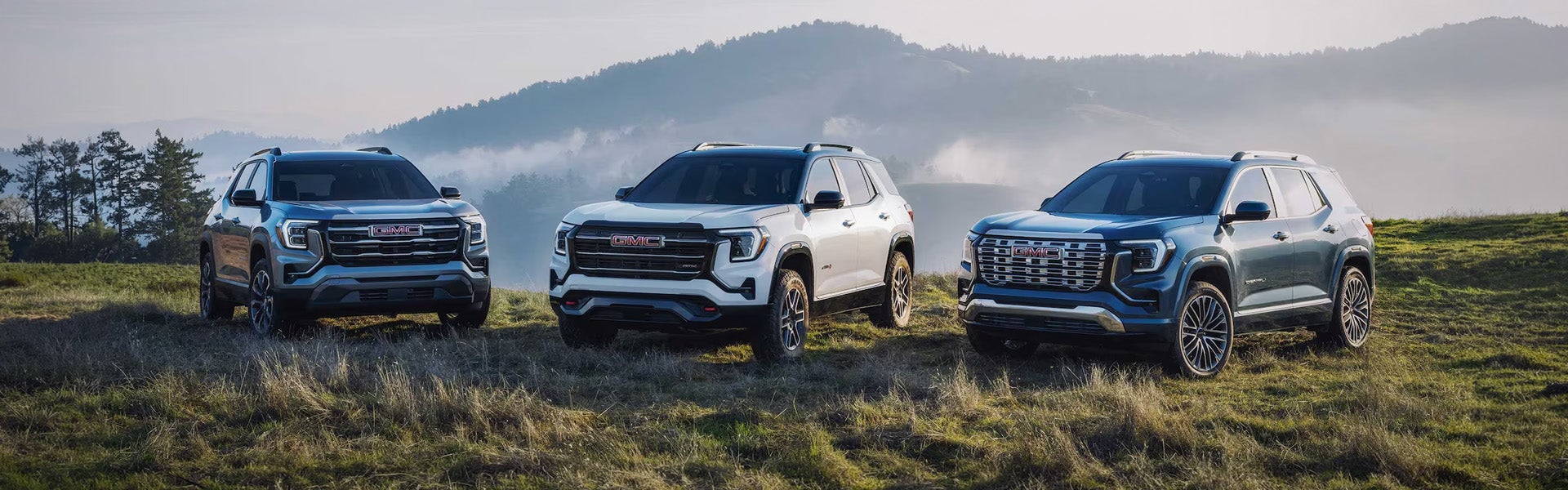 2026 GMC Terrain SUVs on a grassy hillside